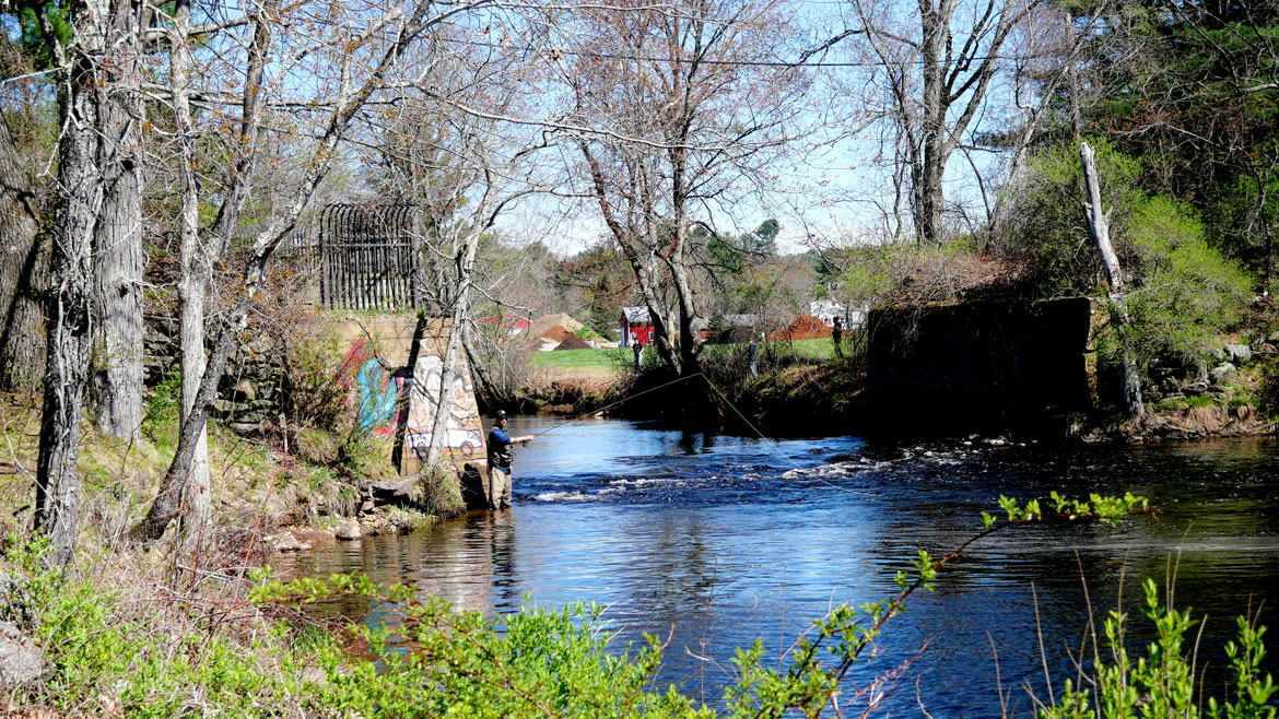 Downstream of the Wheelwright Dam, the Hardwick Pond Road bridge in Ware is a popular spot for fishing, April 26, 2026. (©Greg Cook photo)