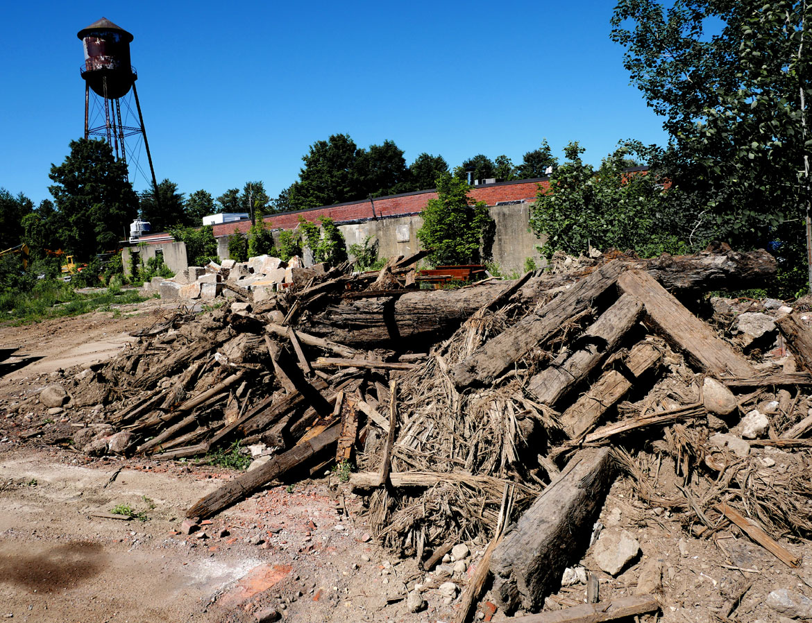 Pile of timbers removed from the Wheelwright Dam, June 9, 2026. (©Greg Cook photo)