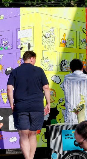 “All This, All at Once” mural by Ansis Puriņš and Blipblipbeep (Jennifer Puriņš) outside the Harvard Ed Portal in Allston, June 2026. (Greg Cook photo)