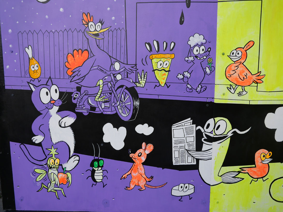 “All This, All at Once” mural by Ansis Puriņš and Blipblipbeep (Jennifer Puriņš) outside the Harvard Ed Portal in Allston, June 2026.