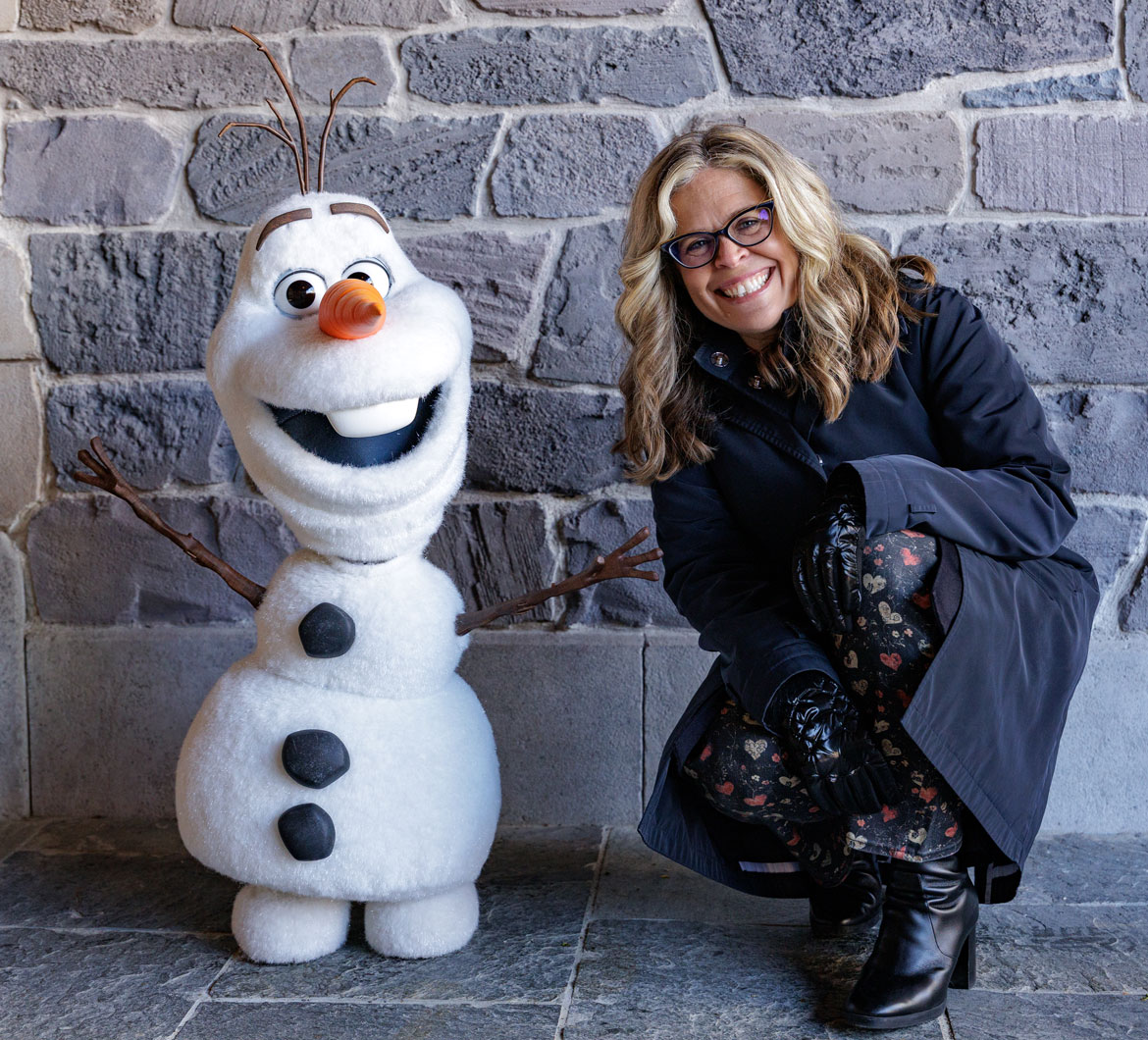 "Frozen" writer and director Jennifer Lee with the free-roaming Audio-Animatronics snowman Olaf at Disneyland Paris, from "Worldbuilders."