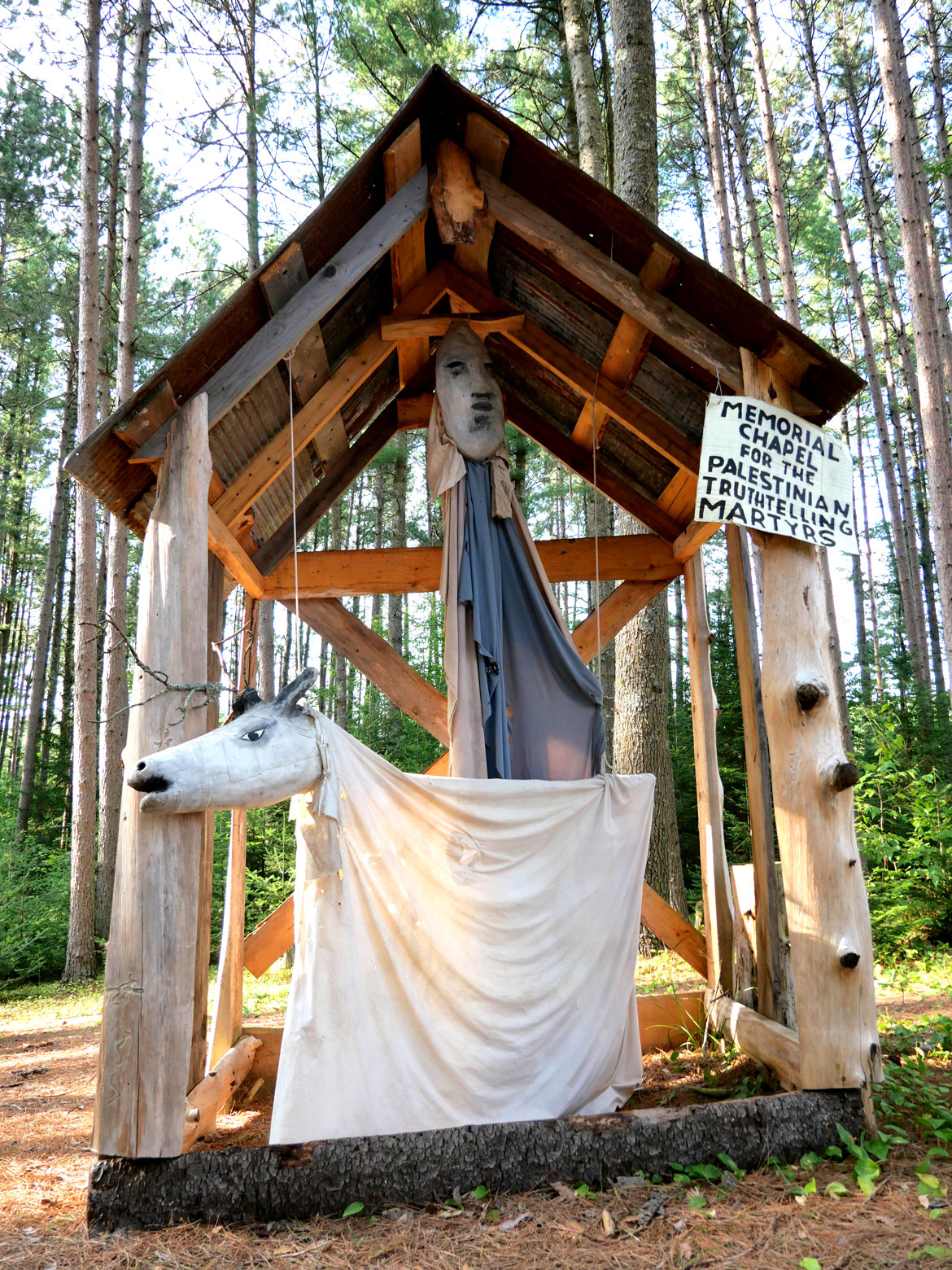 Memorial to killed Palestinians, in the Pine Forest, for Bread and Puppet Theater's "Upside Down World Resurrection Pageant," performed on their Glover, Vermont, farm, July 26, 2026. (©Greg Cook photo)