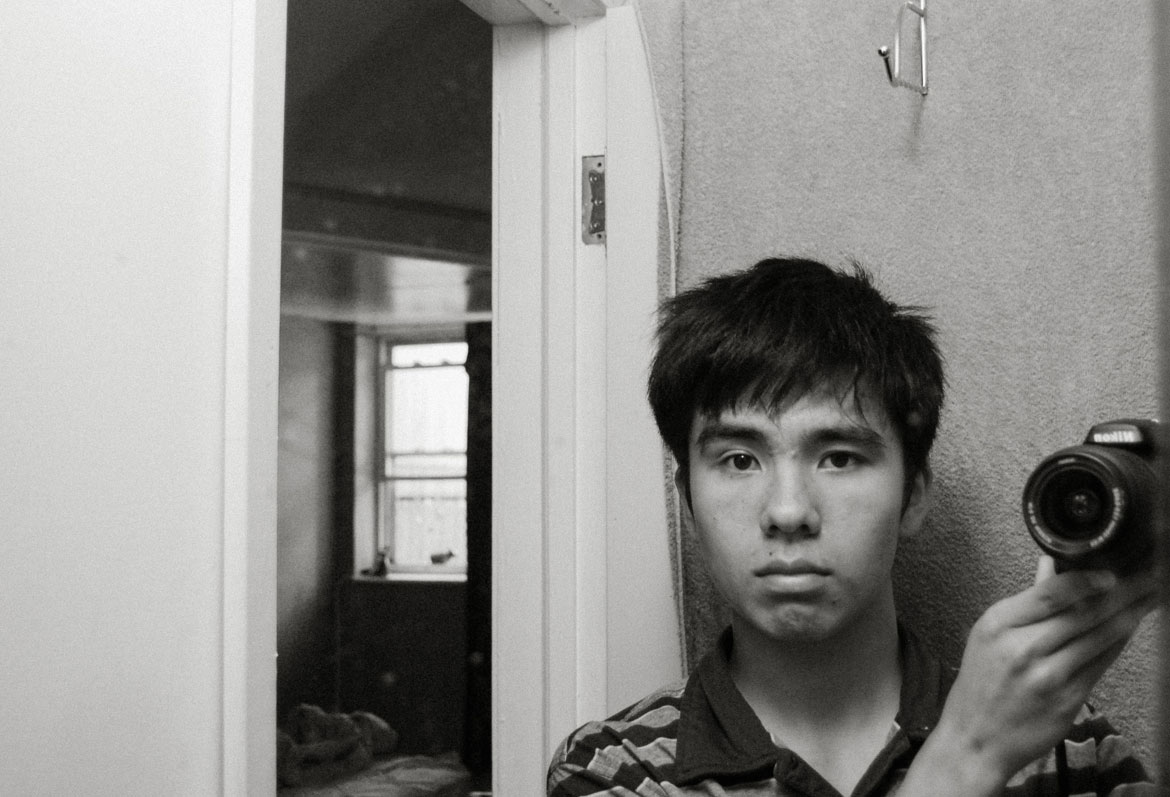 Ocean Vuong, "self-portrait on 18th birthday with borrowed Nikon," 2006. Inkjet print. Courtesy of the artist.
