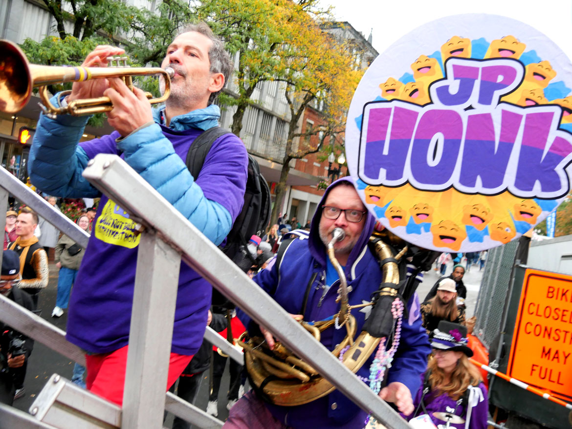 Jamaica Plain Honk Band (JP Honk) from Boston steps up onto the Honk Festival main stage in Cambridge's Harvard Square, Sunday, Oct. 11, 2026. (©Greg Cook photo)